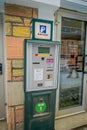 Bodo, Norway - April 09, 2018: Outdoor view of payphone machine located in the streets of Bodo, during winter Royalty Free Stock Photo