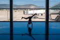 05/26/2019. Bodrum Airport / Milas Mugla Airport. Turkey. Small girl doing cartwheels exercise out of boredom while awaiting for h