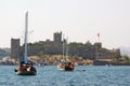 Bodrum beach with ancient citadel and boats