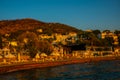 BODRUM, TURKEY: Cityscape on the boardwalk with boat view in the evening at sunset in Bodrum.