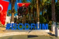 BODRUM, TURKEY: Huge blue letters of Bodrum, the sign and the name of the city of Bodrumon a sunny day.