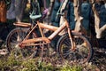 Old rusty bicycle for children used as a decorative object in a garden