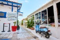 Bodrum, Turkey - 12.05.2022. Narrow cozy street of Bodrum town in Turkey. White and blue street cafe and restaurant