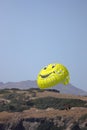 Parasailing on the sea, speed boat and couple on parachute with on mountain background.