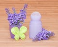 Body antiperspirant deodorant roll-on with flowers and felt Royalty Free Stock Photo