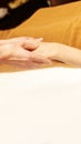 Body arm stone massage. Hot rock masseur. Girl at salon with doctor hands. Relax spa resort Royalty Free Stock Photo