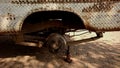 The body and axle of a rusty pickup truck