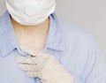 Body in blue shirt, protective mask and hand in white glove Royalty Free Stock Photo