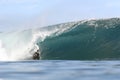 Body boarder riding large wave