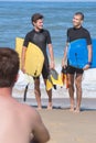 body boarders surf on beach