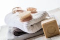 Wooden brushes, solid soap and towels for green friendly bath