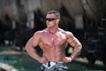 Body Builder Posing At The Railroad Royalty Free Stock Photo