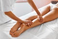 Body care. Close-up of woman getting spa treatment. Legs massage Royalty Free Stock Photo