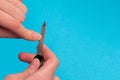 Body-care of hands. Woman polishing fingernails with the nail file Royalty Free Stock Photo