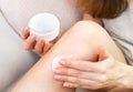 Body care at home. Young girl applying cream after depilation. Close-up. Selective focus Royalty Free Stock Photo