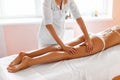 Body care. Legs massage in spa salon Royalty Free Stock Photo