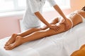 Body care. Legs massage in spa salon Royalty Free Stock Photo