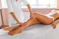 Body care. Spa treatment. Massage of human legs in spa salon Royalty Free Stock Photo