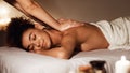 Body care. Woman enjoying relaxing back massage Royalty Free Stock Photo