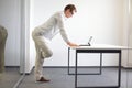 Leg stretching durring office work Royalty Free Stock Photo