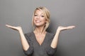 Body language concept for satisfied 20s blond woman Royalty Free Stock Photo