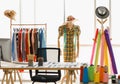 Body mannequin wearing hat and carrying measure are costume for fashion designer stylish in dressing bright room with many colour