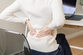 Body muscles stiff problem, asian young attractive woman, girl pain with back pain ache from computer work, holding massaging