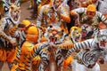 Body painted people perform `tiger dance`