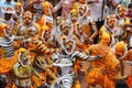 Body painted people perform `tiger dance`