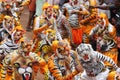 Body painted people perform `tiger dance`