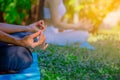 Body part group people have meditation for yoga.They are play yoga in park.