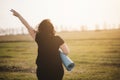 Overweight woman celebrating rising hands to sky