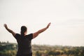 Overweight woman rising hands to the sky