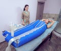 Body pressotherapy machine on woman in beauty center