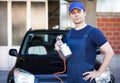 Body repairer holding a spray gun