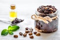 Body scrub of ground coffee with oil on white table background Royalty Free Stock Photo