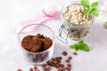 Body scrub of ground coffee and peppermint sugar in glass jar, homemade cosmetic for peeling Royalty Free Stock Photo