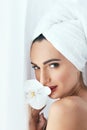 Body Skin Care. Beautiful Woman In Towel With Flower In Spa Salo Royalty Free Stock Photo