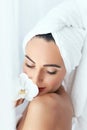 Body Skin Care. Beautiful Woman In Towel With Flower In Spa Salo Royalty Free Stock Photo