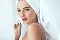 Body Skin Care. Beautiful Woman In Towel With Flower In Spa Salo Royalty Free Stock Photo