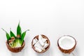 Body treatment. Coconut lotion on white background top view copyspace