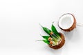 Body treatment. Coconut lotion on white background top view copyspace