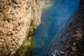 Body of water between gentle colored stones Royalty Free Stock Photo