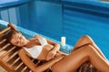 Body Woman Care. Girl Relaxing beside Pool. Spa Royalty Free Stock Photo