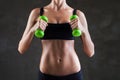 Body of young fit woman lifting dumbbells Royalty Free Stock Photo