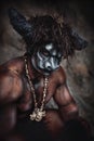 The bodyart man angry minotaur with axe in cave