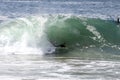A bodyboarder catching a wave at The Wedge in Newport Beach