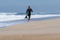 Bodyboarder running