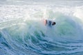 Bodyboarder surfing ocean wave