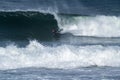 Bodyboarder surfing ocean wave